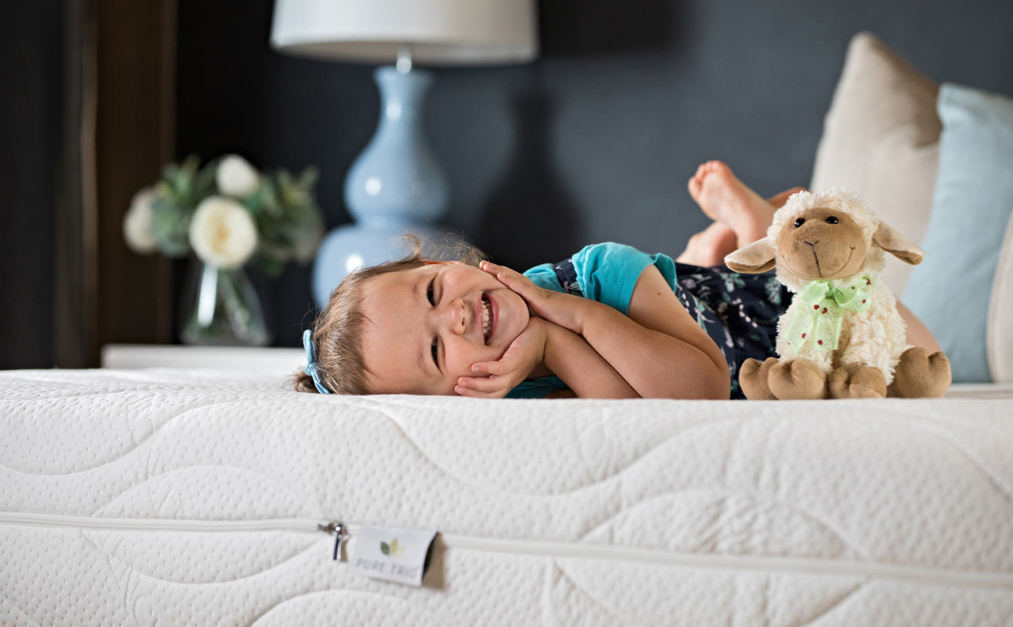 child on latex mattress